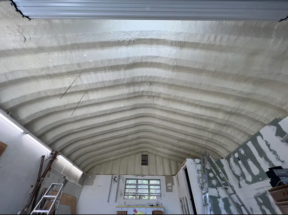 Spray polyurethane foam applied to the underside of a metal roof deck in Loganville
